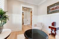On the other side of the foyer is a guest suite, complete with a well-lit bedroom and beautiful bath with zero-step entry tiled shower.