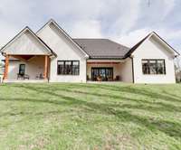 This is the rear view of the beautiful home at 1036 Wilderness Way, and the end of our picture story.  Please call today to set up a time to see this beautiful home in person!