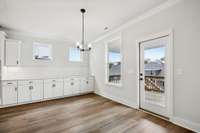 Dining area with built in buffet. Sliding pull out drawers in each cabinet