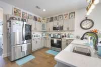 Stylish gray cabinets and stainless appliances