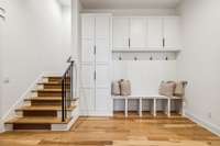 Built-in mudroom storage outside of garage entry for bookbags, shoes, and drop zone