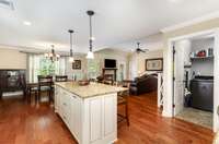 Kitchens open to dining and living room.
