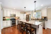 Lots of cabinetry and a pantry in this kitchen.