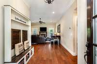 Large entry way leading to open living dining and kitchen.