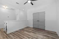 Large loft space with bedroom off of it