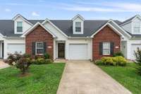 Long driveway with attached one-car garage