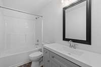 Primary bathroom with large vanity and spacious shower/tub