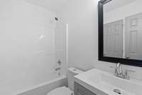 Large bathroom with shower/tub for second downstairs bedroom