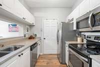 Great kitchen open to the living space with washer/dryer and pantry closet