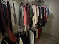 Walk-in closet in primary bedroom.