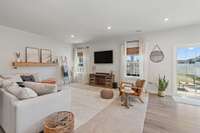The main floor living room of this home showcases the natural light, and the integrated nature of the rooms on this level. Light, open and warm describe this house perfectly!