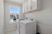 Upstairs utility room saves you the trouble of transporting laundry up and down the stairs!