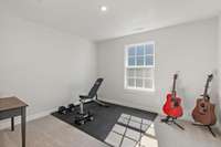 Bedroom 3 currently set up as a workout room.
