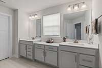 Note the vanities and countertops match the kitchen! Also the real tile flooring!