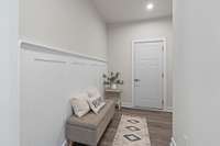Coming in from the Garage you are greeted with custom judges paneling, and a mud room area with a large catch-all coat closet.