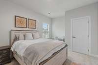 The main floor bedroom is 14x11 and features its own private full bathroom access and large closet.