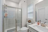 Note the walk-in tile shower, and matching quartz vanity, yet more upgrades!