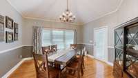 ~ Dining Room With Gleaming Hardwood Flooring & Vaulted Ceiling ~