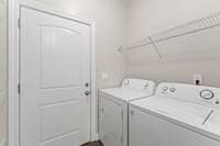 Right off of the kitchen is the laundry. Best part...The washer and dryer stay!