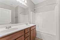 Primary Bathroom features a double vanity and a storage cabinet!