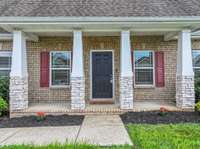 A front porch perfect for sipping your favorite beverage!
