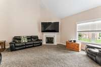 The living room has a fireplace for those cold winter nights!