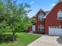 Mature trees and low maintenance landscaping!