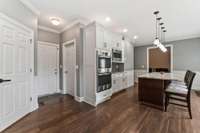 There is a pantry in the door on the left. The other two doors are the entry to the garage and the laundry room
