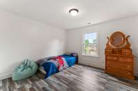 Bedroom 3 is also upstairs and faces the backyard.