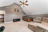 Another view of the bonus room showing the vaulted ceilings and plenty of space