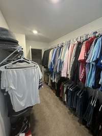 Wow! That's a huge walk-in master closet. There's a window too!