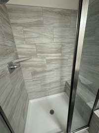 Beautiful tiled shower and bench in master!