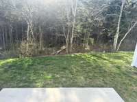Privacy - wooded - backyard! Enjoy your tea and coffee on the back patio. Last secluded lot available!