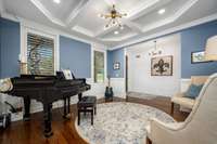Music room with view of the foyer.