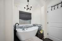 Showing the tub in the primary bathroom.