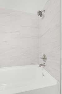 New tiled showed with brand new tub