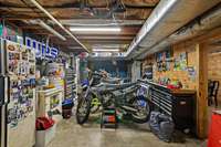 Tons of Garage space left in the unfinished portion of basement (almost 1,000 sq ft unfinished!). Washer and dryer hookups are in the basement as well. This home was set up and used as a multi-family home!