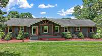 Mature landscaping. New Cedar Shutter. Camera security system (5 cameras) will remain