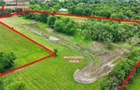 Motocross track for the dirt bike enthusiast, or seller can fill/grade away with his tractor