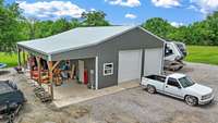 Shop has 12x40 Concrete porch/carport