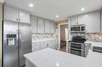 Backsplash, under-cabinet lighting, All the upgrades, custom shelving!