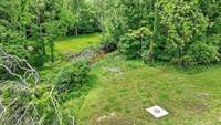Creek and Sewer connection at the back of the property! Home does not require flood insurance because the creek is at the very back of property.