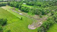 All 12.8 acres of usable, beautiful land! Fish in the creek, ride 4 wheelers through the wooded area. There's so much land, just a half a mile away from Station Camp Schools!
