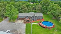 Well-maintained Home with mature trees surrounding!