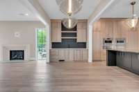 Enjoy the wet bar with ice maker and extra dishwasher