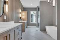 Grand primary sweet with separate vanities and valets, smart toilets, hidden closet.