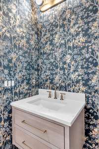 Custom wallpaper in the powder bath on the main floor