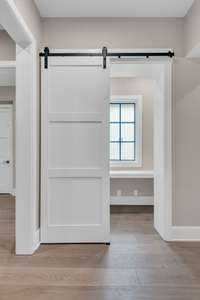 Right off the kitchen holds the perfect nook for extra storage or can be an office.
