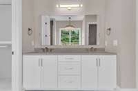 Large soaking bath and double vanities
