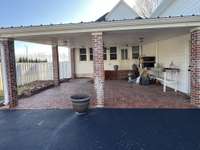 Carport with Entrance into the Mud Room and Den